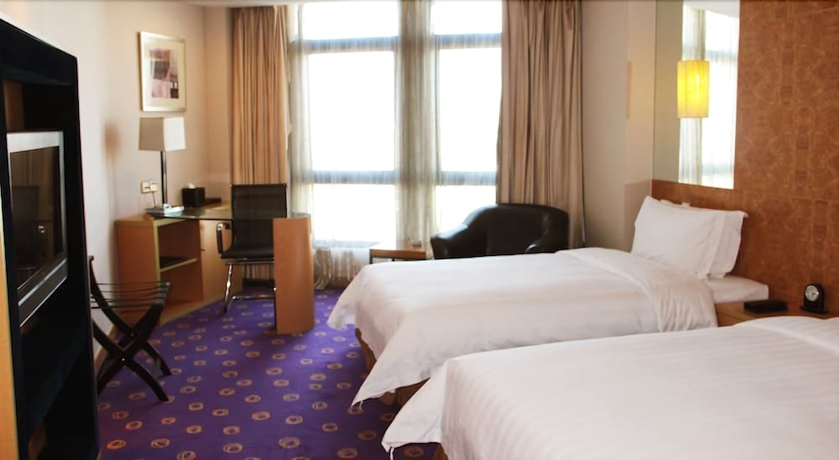 Imagen de la habitación del Hotel Ramada Plaza Pu Dong South Shanghai. Foto 12