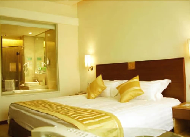 Imagen de la habitación del Hotel Ramada Plaza Pu Dong South Shanghai. Foto 15