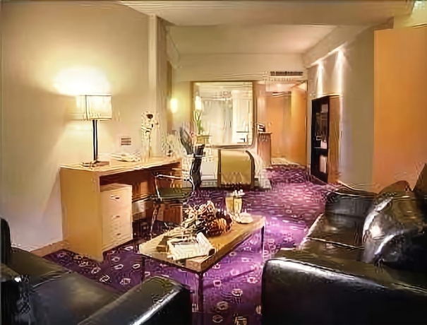 Imagen de la habitación del Hotel Ramada Plaza Pu Dong South Shanghai. Foto 16