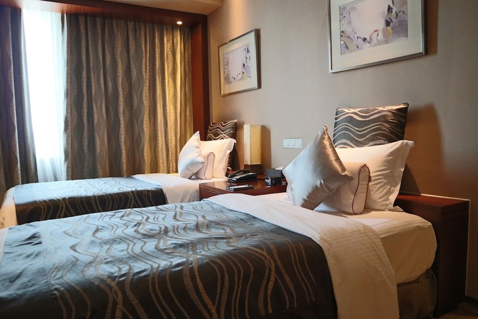 Imagen de la habitación del Hotel Ramada Plaza Shanghai Caohejing. Foto 2