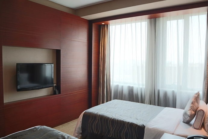Imagen de la habitación del Hotel Ramada Plaza Shanghai Caohejing. Foto 3