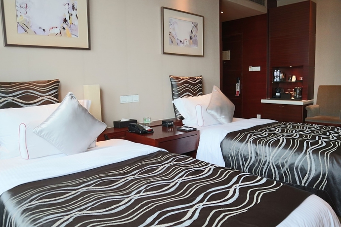 Imagen de la habitación del Hotel Ramada Plaza Shanghai Caohejing. Foto 8