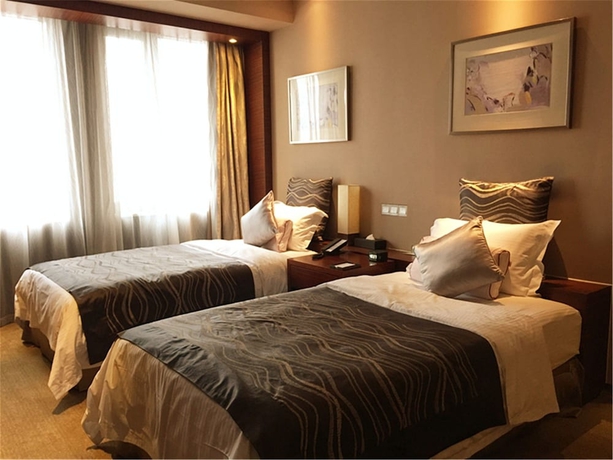 Imagen de la habitación del Hotel Ramada Plaza Shanghai Caohejing. Foto 9