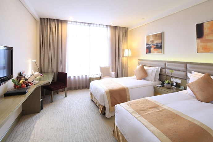 Imagen de la habitación del Hotel Ramada Plaza Shanghai Caohejing. Foto 10