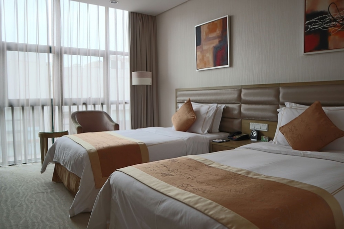 Imagen de la habitación del Hotel Ramada Plaza Shanghai Caohejing. Foto 11