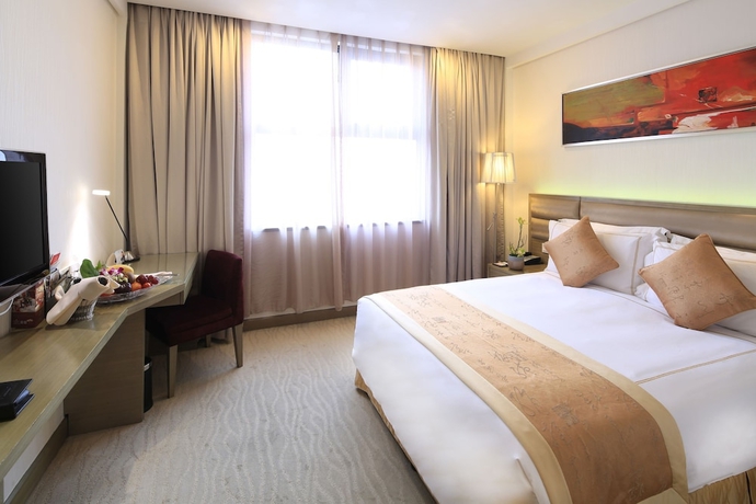 Imagen de la habitación del Hotel Ramada Plaza Shanghai Caohejing. Foto 13