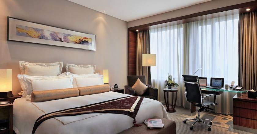 Imagen de la habitación del Hotel Ramada Plaza Shanghai Caohejing. Foto 14