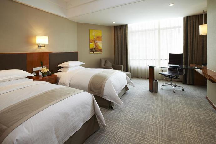 Imagen de la habitación del Hotel Ramada Plaza Shanghai Pudong Airport. Foto 4