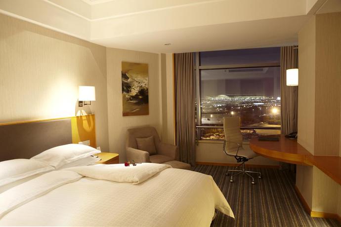 Imagen de la habitación del Hotel Ramada Plaza Shanghai Pudong Airport. Foto 8