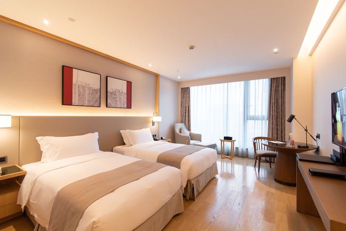 Imagen de la habitación del Hotel Ramada Plaza Wyndham Wenzhou Cangnan. Foto 1