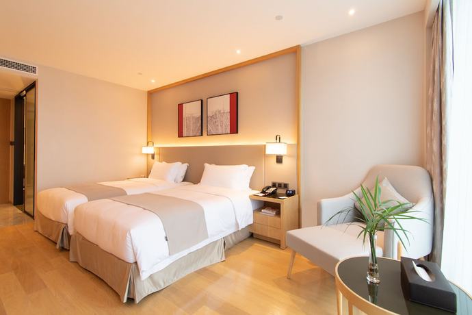 Imagen de la habitación del Hotel Ramada Plaza Wyndham Wenzhou Cangnan. Foto 2