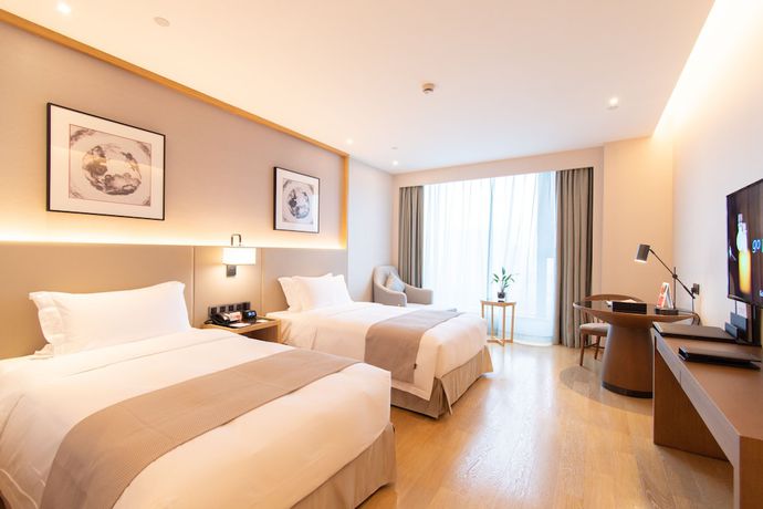 Imagen de la habitación del Hotel Ramada Plaza Wyndham Wenzhou Cangnan. Foto 12