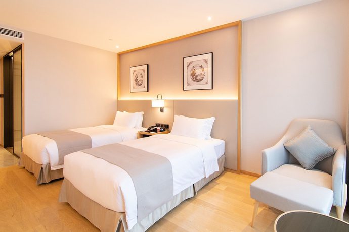 Imagen de la habitación del Hotel Ramada Plaza Wyndham Wenzhou Cangnan. Foto 13