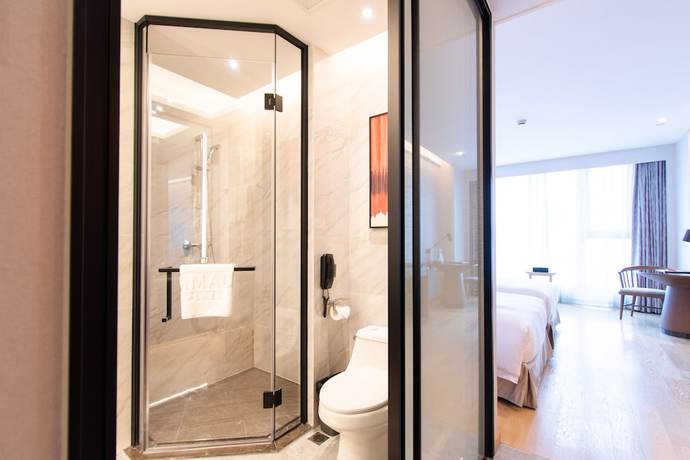 Imagen de la habitación del Hotel Ramada Plaza Wyndham Wenzhou Cangnan. Foto 15