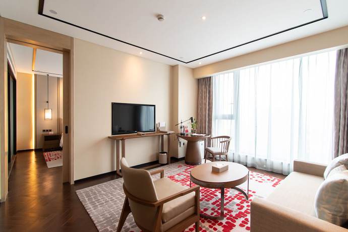 Imagen de la habitación del Hotel Ramada Plaza Wyndham Wenzhou Cangnan. Foto 17