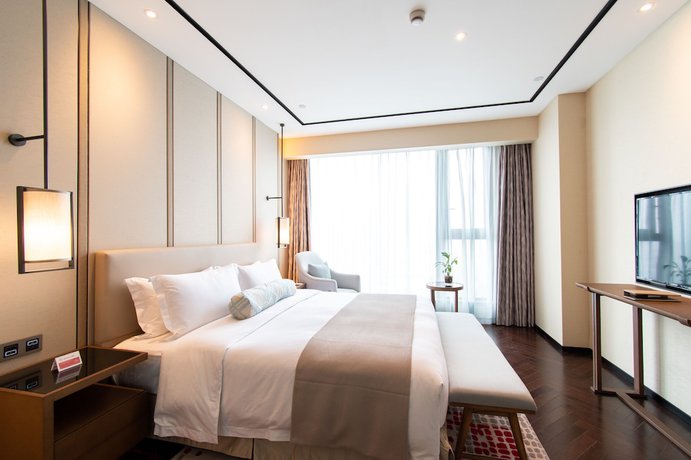 Imagen de la habitación del Hotel Ramada Plaza Wyndham Wenzhou Cangnan. Foto 19