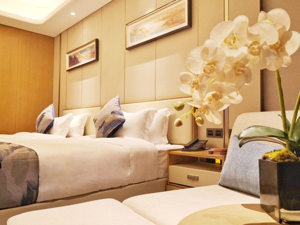 Imagen de la habitación del Hotel Ramada Plaza by Wyndham Dongxing City Center. Foto 3