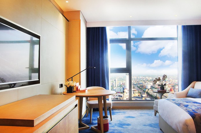 Imagen de la habitación del Hotel Ramada Plaza by Wyndham Dongxing City Center. Foto 7