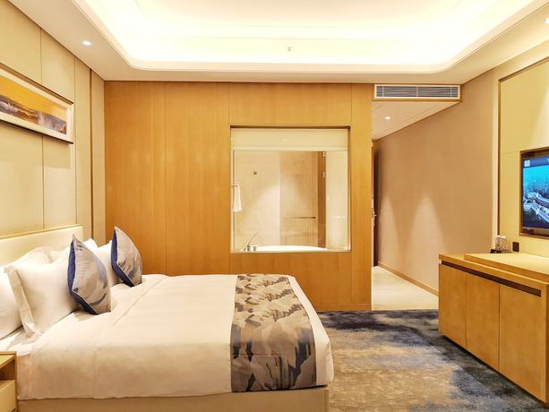 Imagen de la habitación del Hotel Ramada Plaza by Wyndham Dongxing City Center. Foto 10