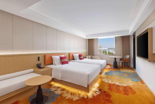 Imagen de la habitación del Hotel Ramada Plaza by Wyndham Ezhou Binjiang. Foto 6