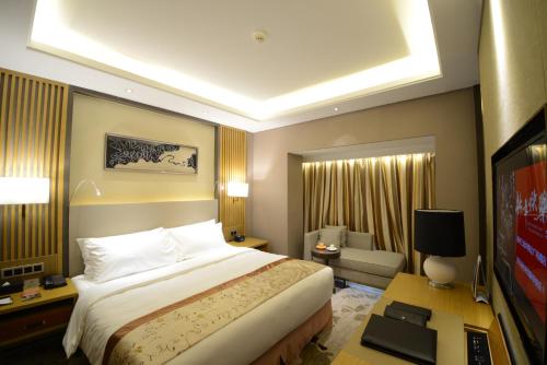 Imagen de la habitación del Hotel Ramada Plaza by Wyndham Fuzhou South. Foto 3