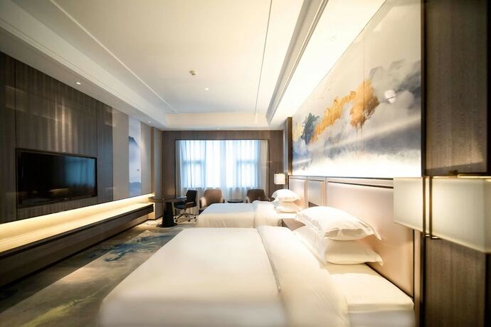 Imagen de la habitación del Hotel Ramada Plaza by Wyndham Hezhou North. Foto 6