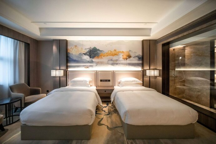 Imagen de la habitación del Hotel Ramada Plaza by Wyndham Hezhou North. Foto 8
