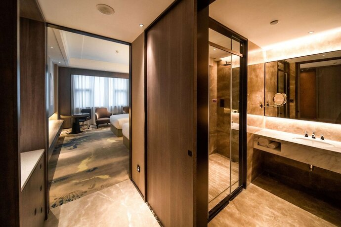 Imagen de la habitación del Hotel Ramada Plaza by Wyndham Hezhou North. Foto 9