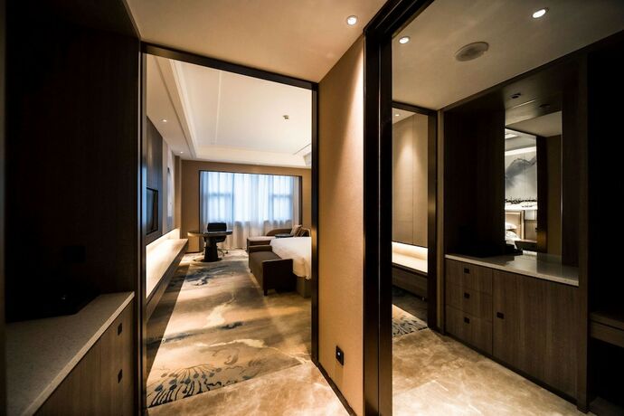 Imagen de la habitación del Hotel Ramada Plaza by Wyndham Hezhou North. Foto 12