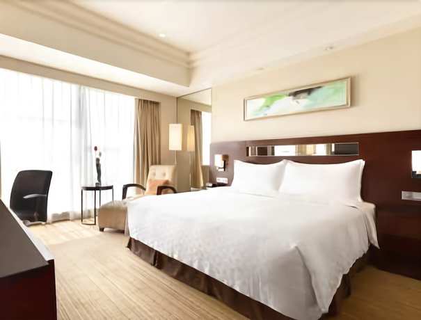 Imagen de la habitación del Hotel Ramada Plaza by Wyndham Lianyungang. Foto 12