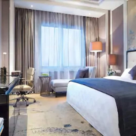 Imagen de la habitación del Hotel Ramada Plaza by Wyndham Tian Lu Hotel Wuhan. Foto 7
