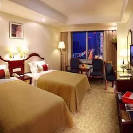 Imagen de la habitación del Hotel Ramada Plaza by Wyndham Tian Lu Hotel Wuhan. Foto 13