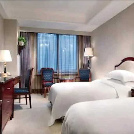 Imagen de la habitación del Hotel Ramada Plaza by Wyndham Tian Lu Hotel Wuhan. Foto 14