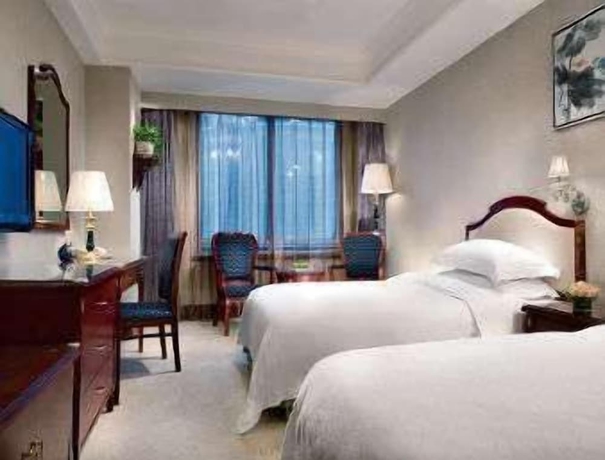 Imagen de la habitación del Hotel Ramada Plaza by Wyndham Tian Lu Hotel Wuhan. Foto 15