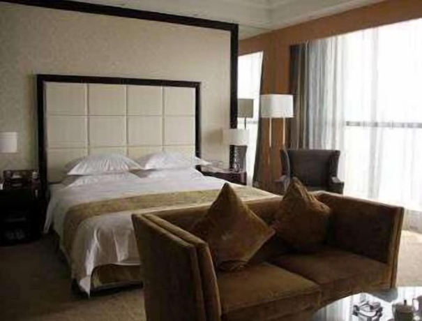Imagen de la habitación del Hotel Ramada Plaza by Wyndham Weifang. Foto 2