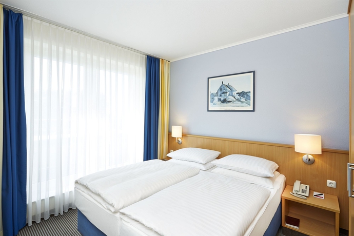 Imagen de la habitación del Hotel Ramada Stade. Foto 7