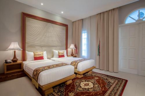 Imagen de la habitación del Hotel Ramada Suites By Wyndham Solo. Foto 5