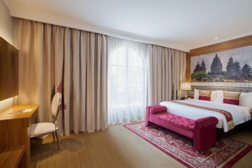 Imagen de la habitación del Hotel Ramada Suites By Wyndham Solo. Foto 7