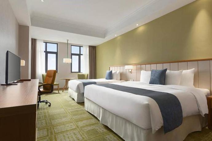 Imagen de la habitación del Hotel Ramada Suzhou. Foto 5