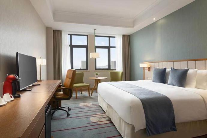 Imagen de la habitación del Hotel Ramada Suzhou. Foto 6