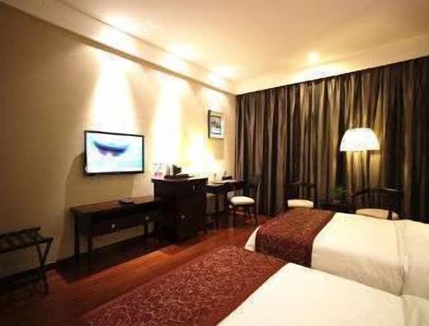 Imagen de la habitación del Hotel Ramada Suzhou Luzhi. Foto 9