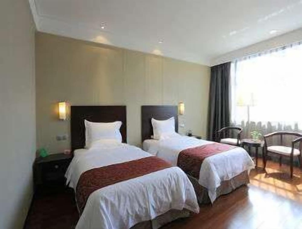 Imagen de la habitación del Hotel Ramada Suzhou Luzhi. Foto 10