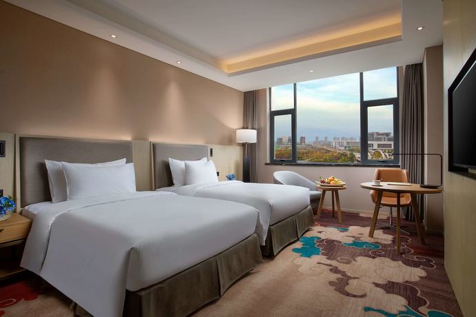 Imagen de la habitación del Hotel Ramada Wyndham Zhengzhou Xinzheng. Foto 1