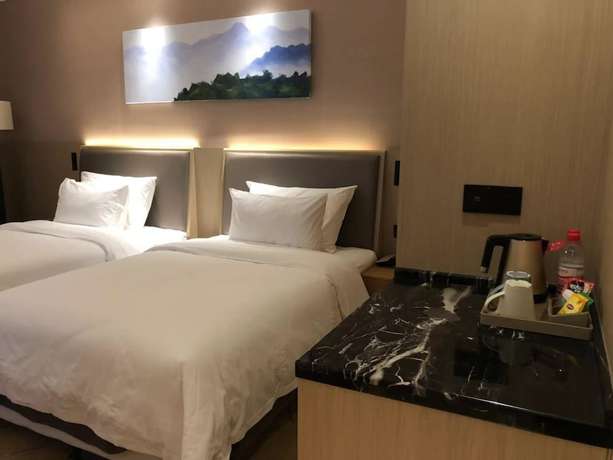Imagen de la habitación del Hotel Ramada Wyndham Zhengzhou Xinzheng. Foto 8