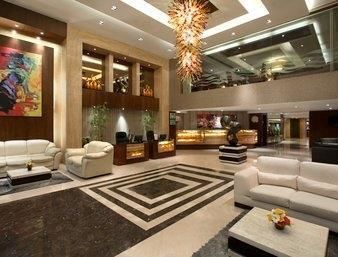 Imagen de la habitación del Hotel Ramada by Wyndham Ahmedabad. Foto 10