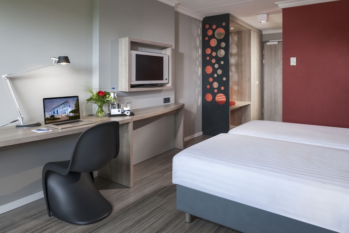 Imagen de la habitación del Hotel Ramada by Wyndham Amsterdam Airport Schiphol. Foto 10