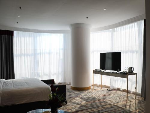 Imagen de la habitación del Hotel Ramada by Wyndham Doha Old Town. Foto 5