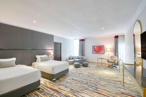 Imagen de la habitación del Hotel Ramada by Wyndham Doha Old Town. Foto 7