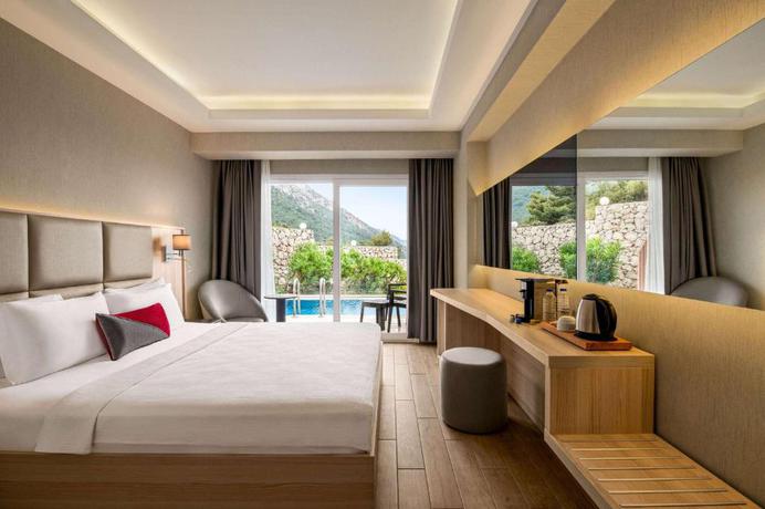 Imagen de la habitación del Hotel Ramada by Wyndham Fethiye Oludeniz. Foto 5