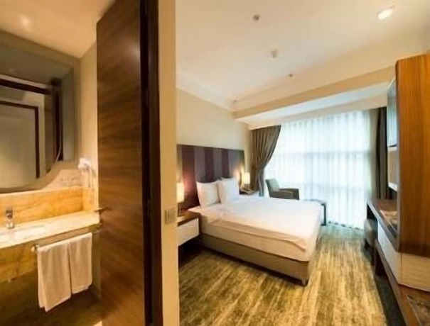 Imagen de la habitación del Hotel Ramada by Wyndham Gemlik. Foto 11